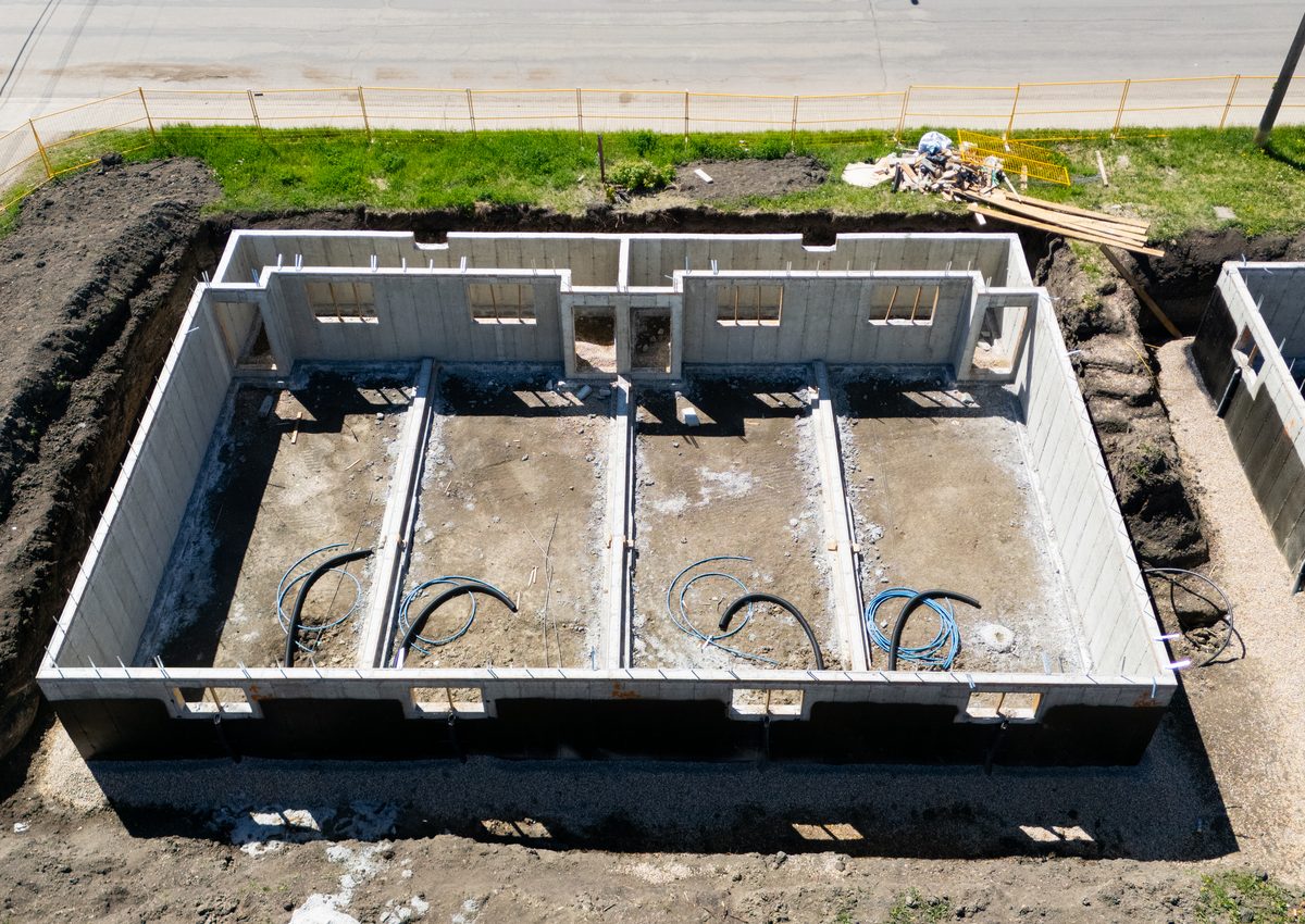 Concrete foundation and structural wall construction photo