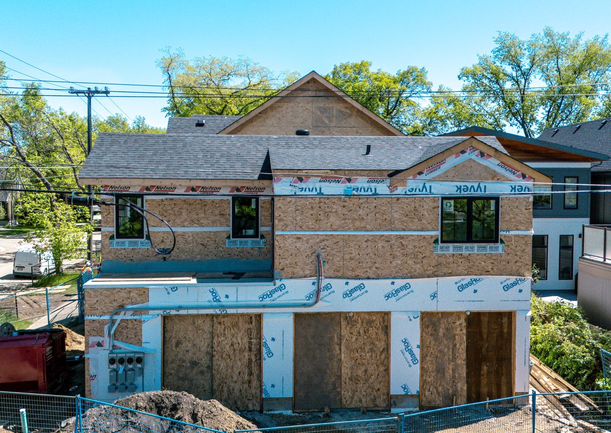 Wood-framed 4-plex under construction in Edmonton, structural engineering by Oasis Engineering