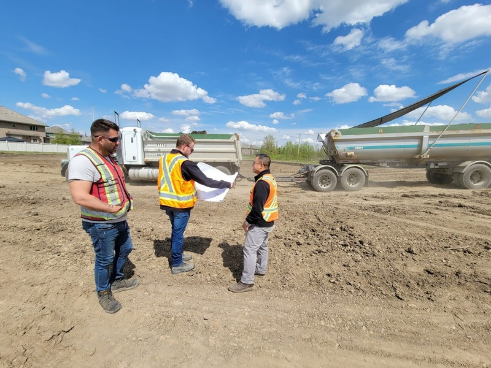 Oasis Engineering staff reviewing drawings with the contractor on site