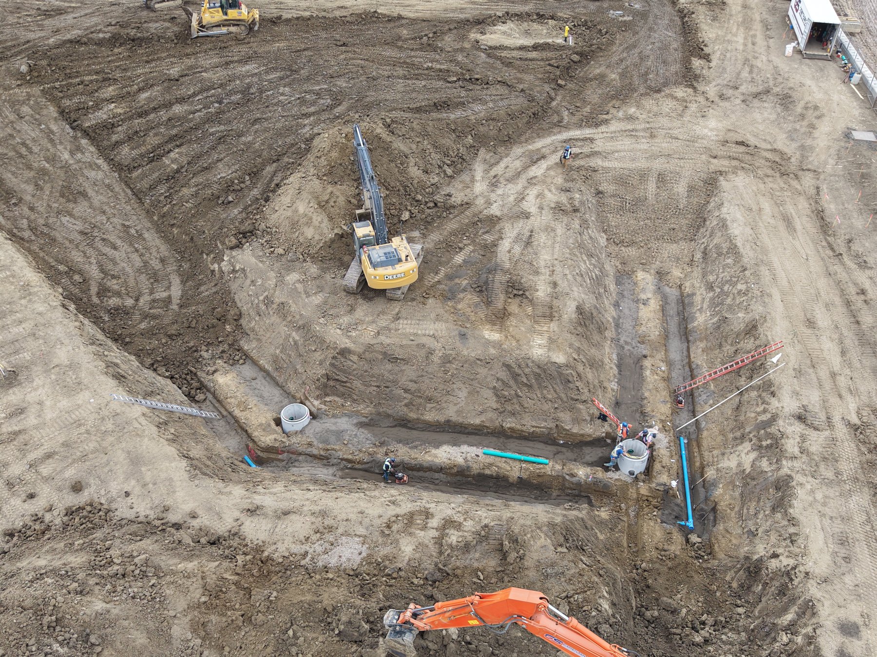 Underground water and sanitary servicing trench on an Edmonton-area site
